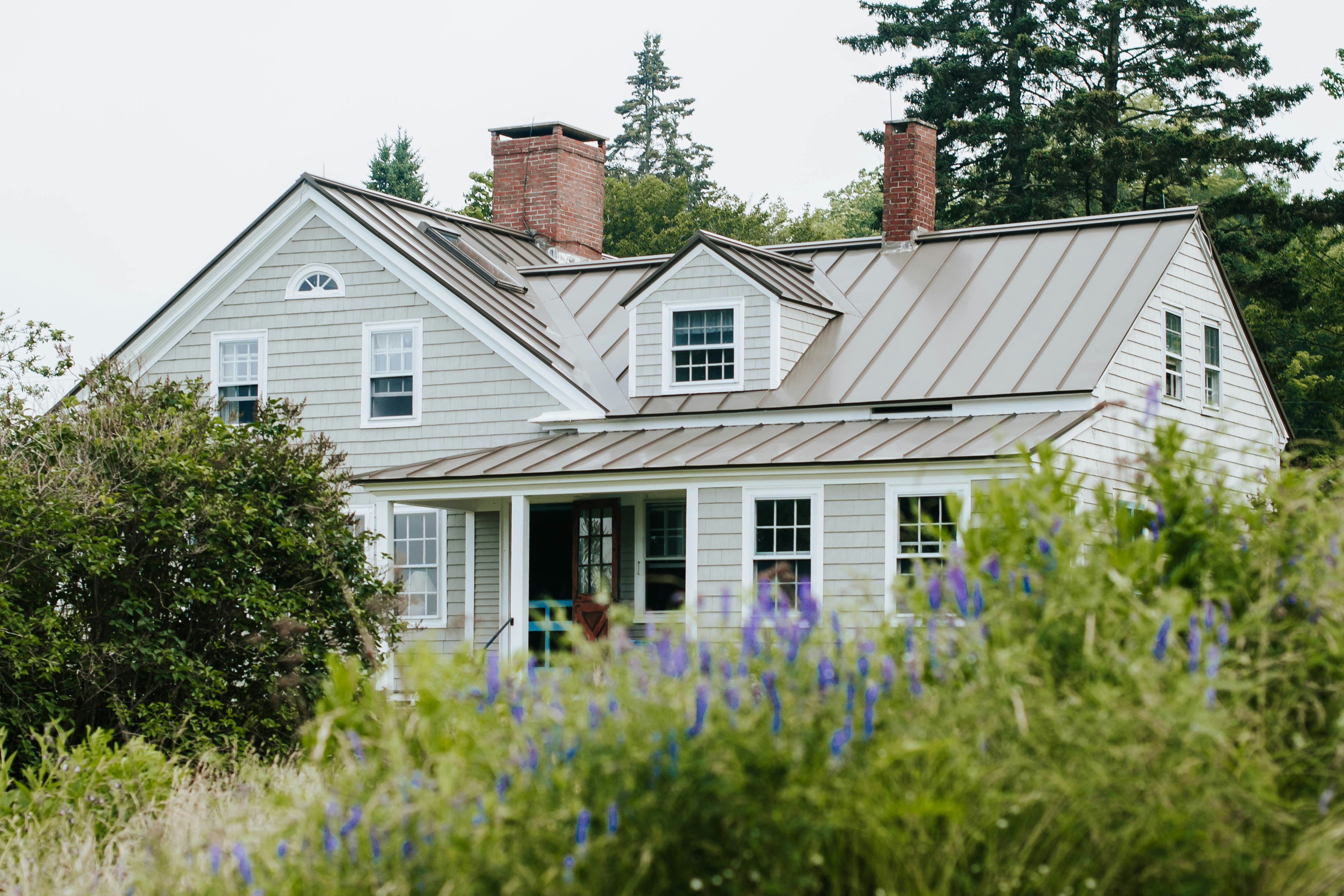 A home with flowers in front of it